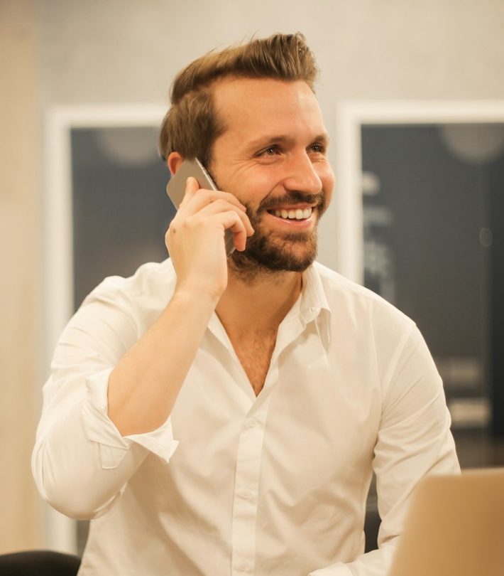 man using smartphone on chair